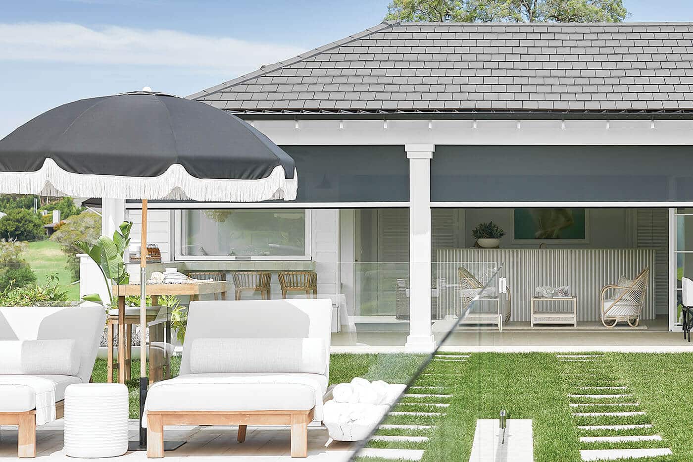 Outside view of a modern and elegant home with patio and a garden, featuring Evo Magnatrack providing shades to the patio. On display in our Complete Blinds Brisbane showroom.