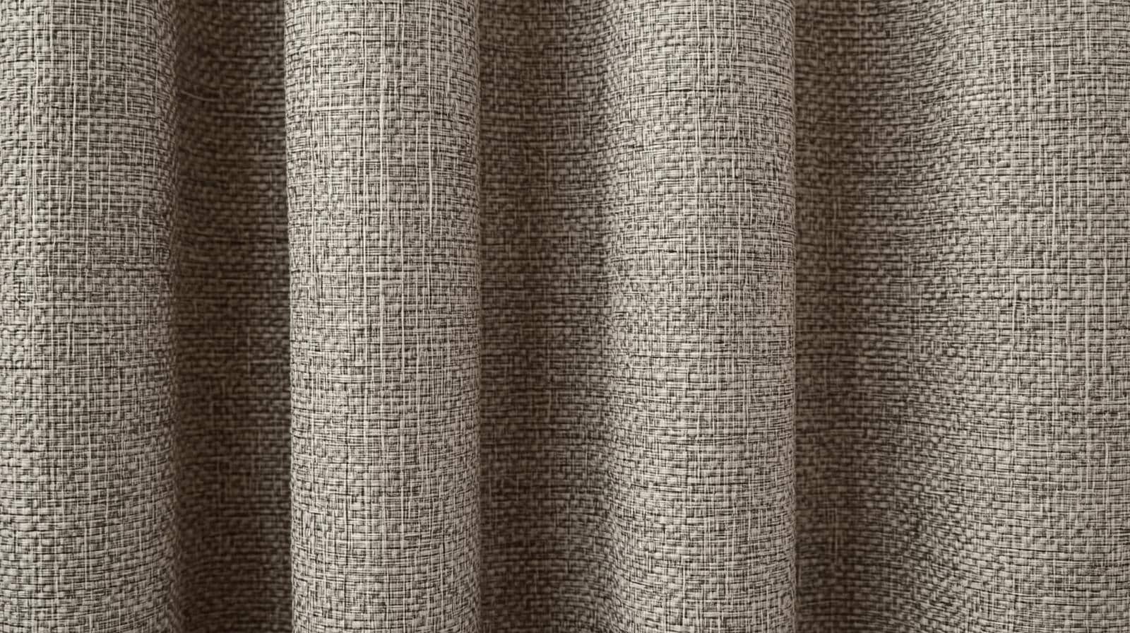 Close-up of triple-weave blockout curtain fabric showing dense light-blocking construction