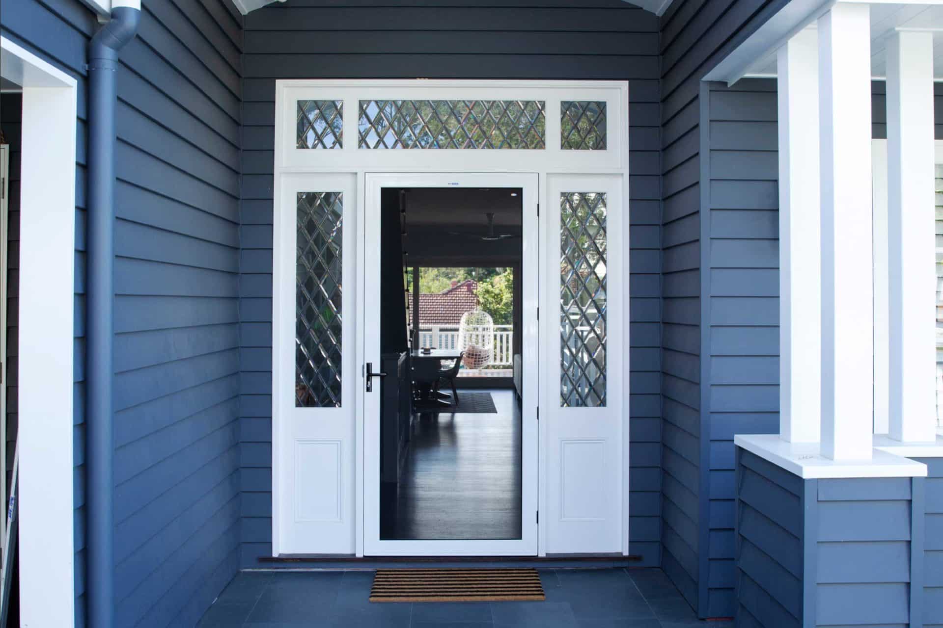 Hinged Crimsafe door at front entry providing security with airflow in Brisbane home