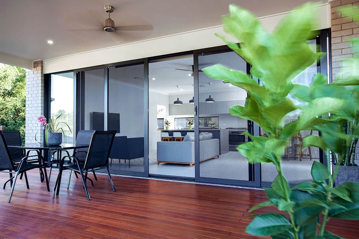 Crimsafe stacking door at front entry providing security with airflow in Brisbane home