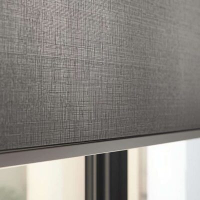 Blockout roller blinds in a Brisbane bedroom providing darkness and heat control