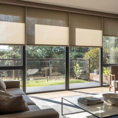 Sunscreen roller blinds in a Brisbane living room reducing glare while maintaining views