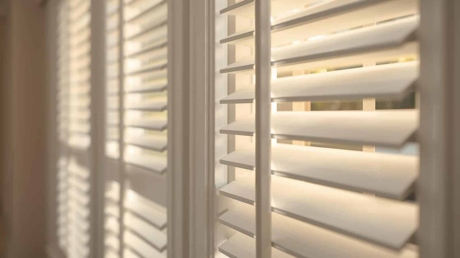 White plantation shutters in Brisbane suburb home with adjustable louvres for light and privacy