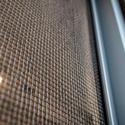 Crimsafe security screen installed on a Brisbane home front entry showing mesh detail and frame finish