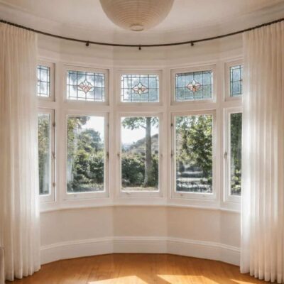 Curved curtain track fitted inside a bay window in a Brisbane home